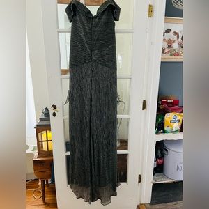 XSCAPE pewter gown size 14. Never been worn. 3 layers, bit of train.
